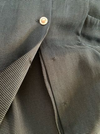 Chaqueta larga o vestido abotonado