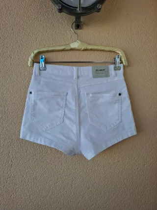 Short tiro alto cremalleras