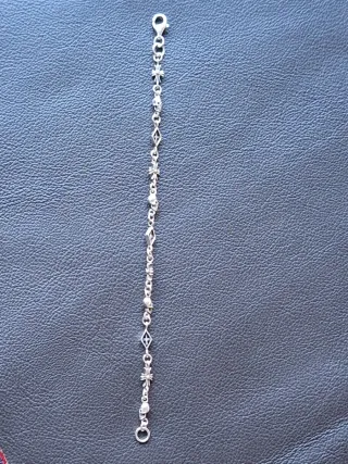 Pulsera de Plata Calaveras y Cruzes,muy detallada.