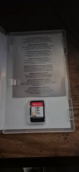 Nintendo Switch Lite Coral + Funda y Caja + Juego