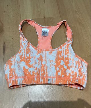 Top deportivo Decathlon naranja y blanco