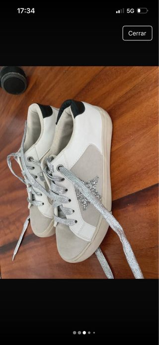 Zapatillas deportivas con estrella plateada