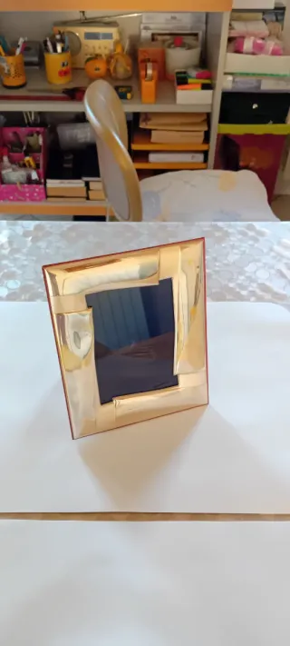 Cornice portafoto in metallo dorato