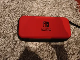 Nintendo Switch + funda+ mandos+ vargador y juegos