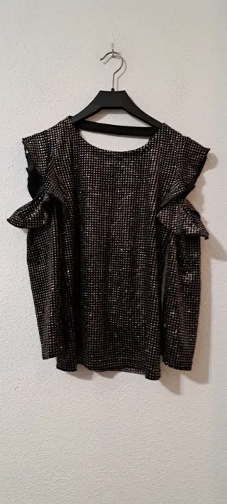 Blusa Sfera negra y dorada con volantes