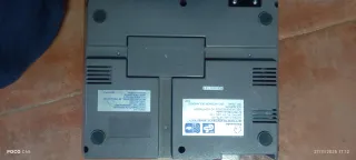 Nintendo NES con mandos, pistola y juegos