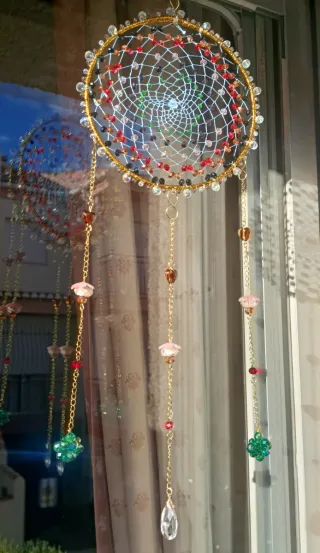 Colgante Atrapasueños artesanal dorado .