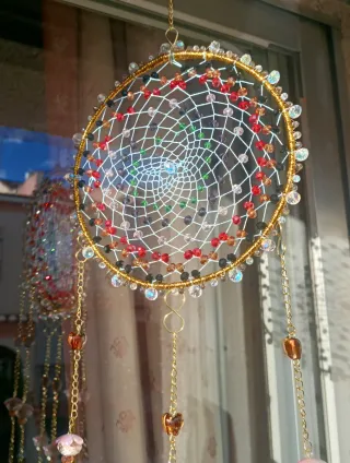 Colgante Atrapasueños artesanal dorado .