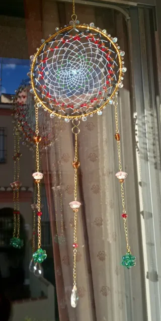 Colgante Atrapasueños artesanal dorado .