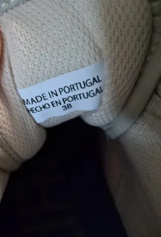 Zapatillas Purificación Garcia blancas y negras