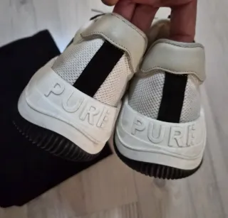 Zapatillas Purificación Garcia blancas y negras