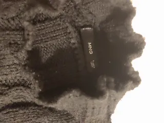 Jersey Mango negro trenzado. De punto