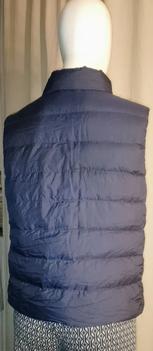 Piumino smanicato blu