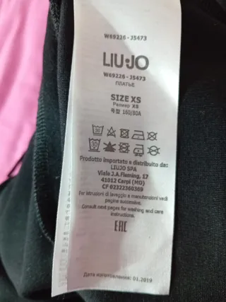 Vestito nero con frange e strass