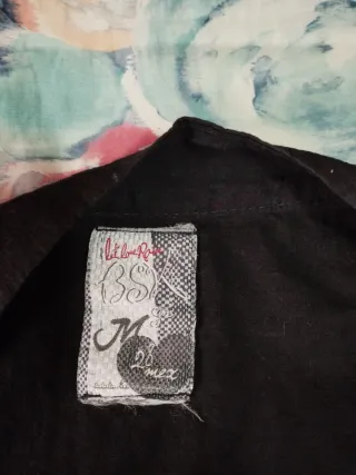 Vestido negro con cremallera bolsillos