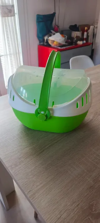 Jaula para pájaros y transportín