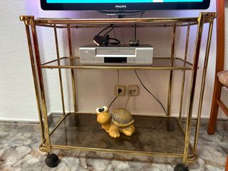 Mesa TV cristal y metal dorada