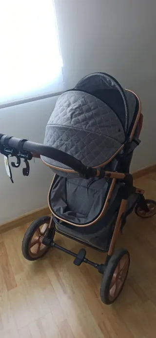 Carrito bebé 3 en 1 gris y cobre