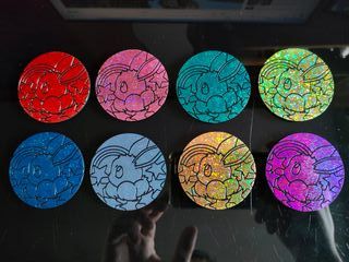 Monedas Pokémon. Evoluciones Prismáticas
