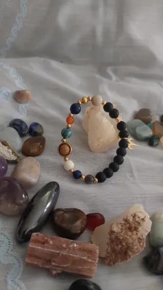 Pulsera Signo Aries Piedra Negra y Dorada