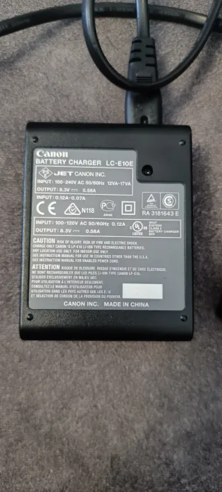 Caricabatterie e batteria originali Canon 1100