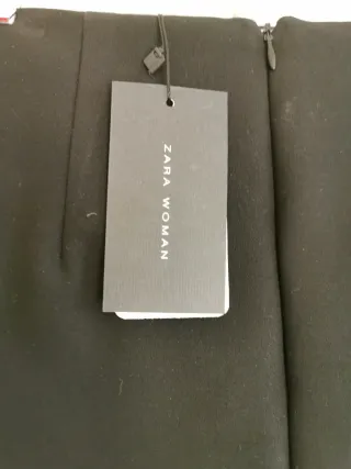 Minifalda negra con anillas y lazo