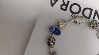 Pulsera Pandora con 9 charms Pandora. Talla 18,5