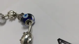 Pulsera Pandora con 9 charms Pandora. Talla 18,5