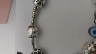 Pulsera Pandora con 9 charms Pandora. Talla 18,5