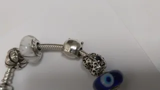 Pulsera Pandora con 9 charms Pandora. Talla 18,5