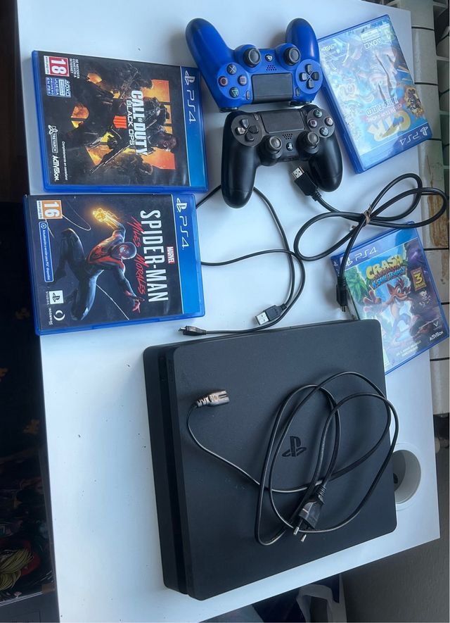 PS4 Slim 1TB (PlayStation 4) 2 mandos, 4 juegos
