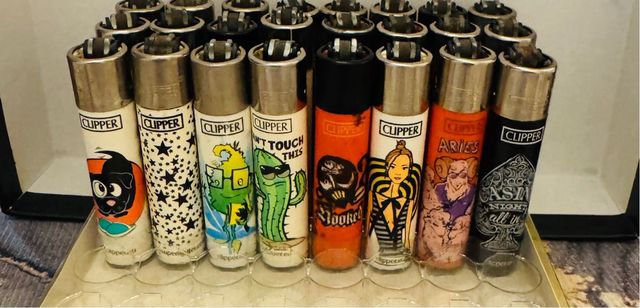 Lote de 48 isqueiros Clipper variados