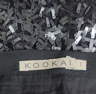 Kookaï/ Minifalda de lentejuelas negra talla 1-S.