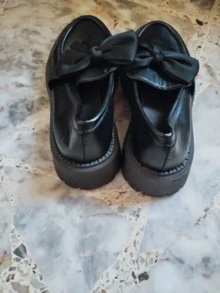 Mocasines negros con lazo