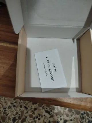 Candela aromatica Zara Home in ceramica pietra beige