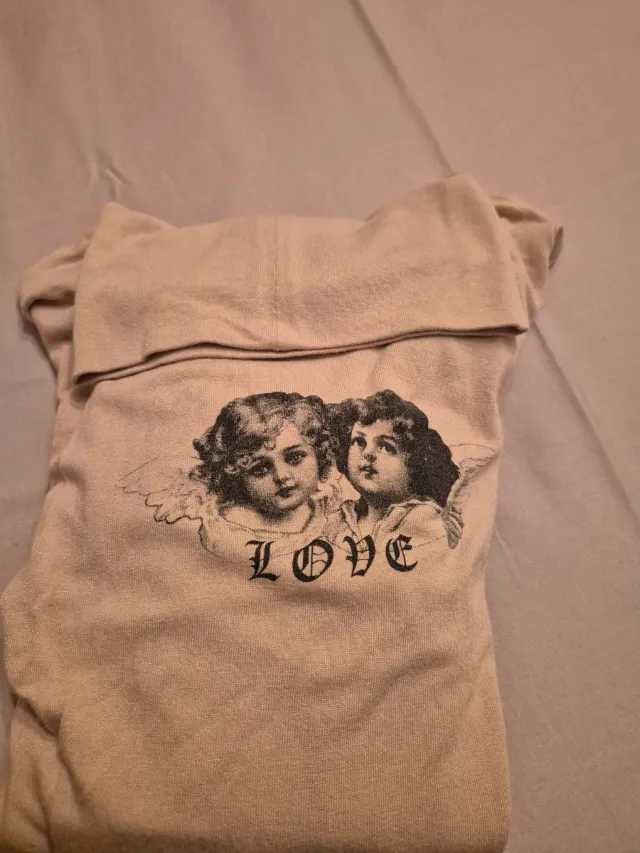 Sottogiacca beige con stampa