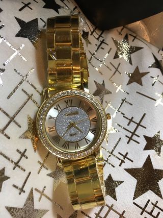 Reloj unisex dorado con pedrería Fiesta