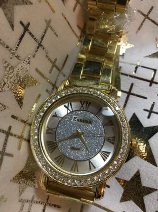 Reloj unisex dorado con pedrería Fiesta