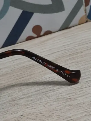 Gafas Miu Miu leopardo doradas