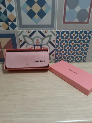 Gafas Miu Miu leopardo doradas