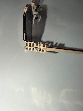 Gafas Miu Miu leopardo doradas