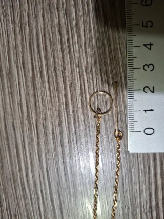 Collana dorata con ciondolo a barra