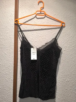 Blusa negra con brillos talla M