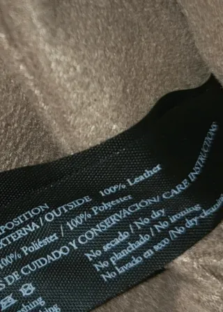 Bolso Tous dorado y amarillo con charms