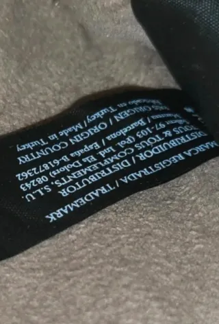 Bolso Tous dorado y amarillo con charms