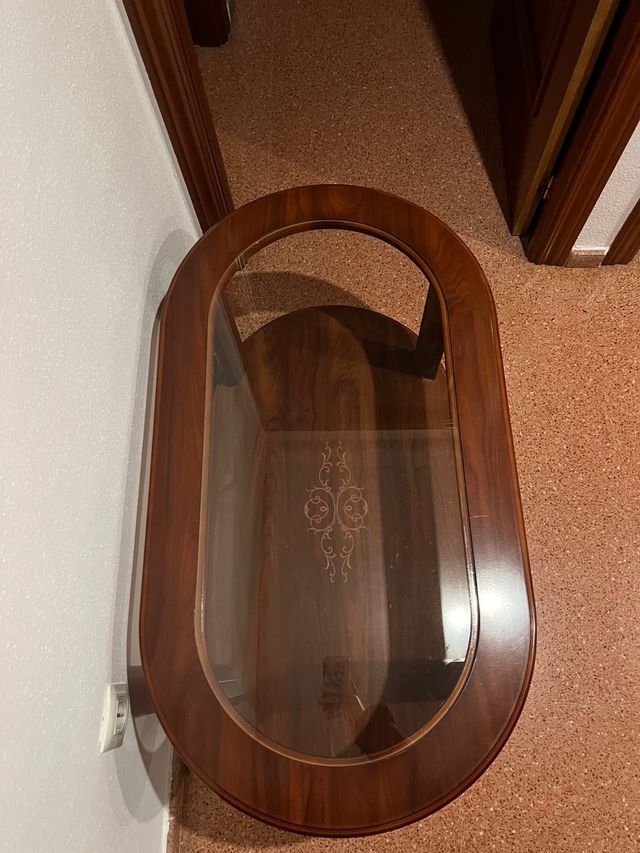 Mesa de comedor ovalada de cristal y madera