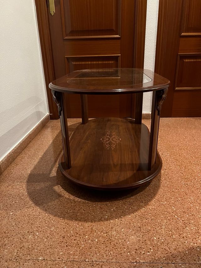 Mesa de comedor ovalada de cristal y madera