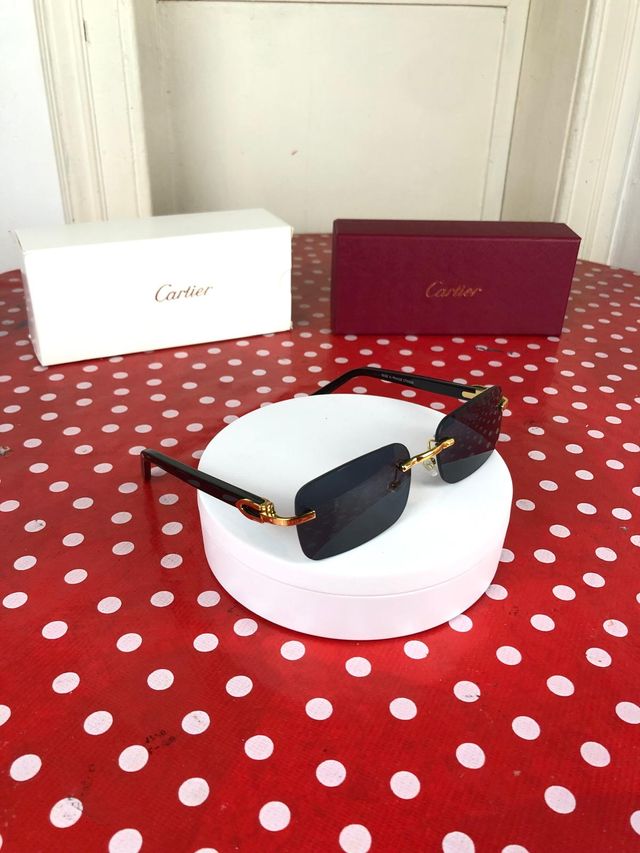 Gafas Cartier –  con montura negra y dorada