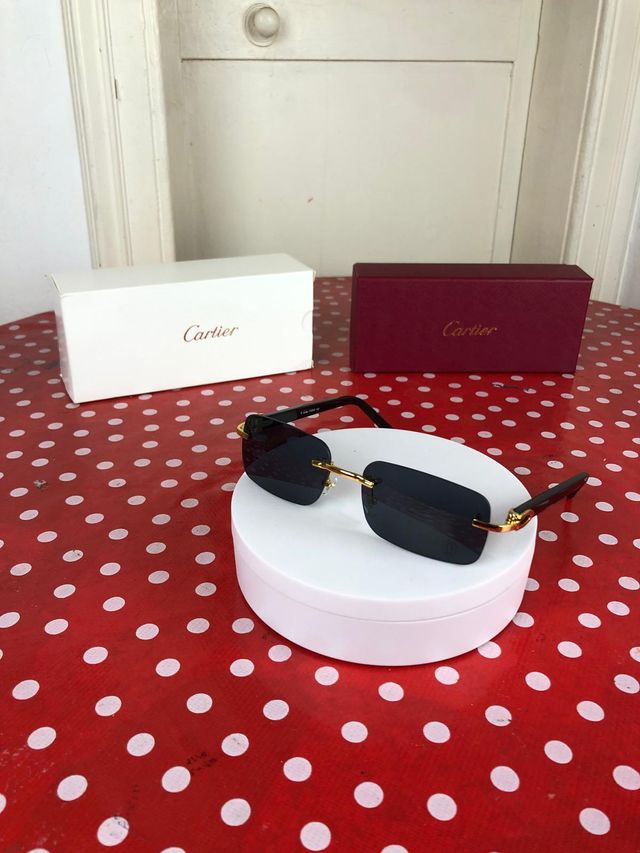 Gafas Cartier –  con montura negra y dorada