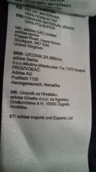 Chaqueta deportiva Adidas negra y azul